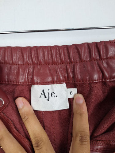 Second-Hand - Aje Wine Faux Leather Cargo Pants Size 6 - SwapUp
